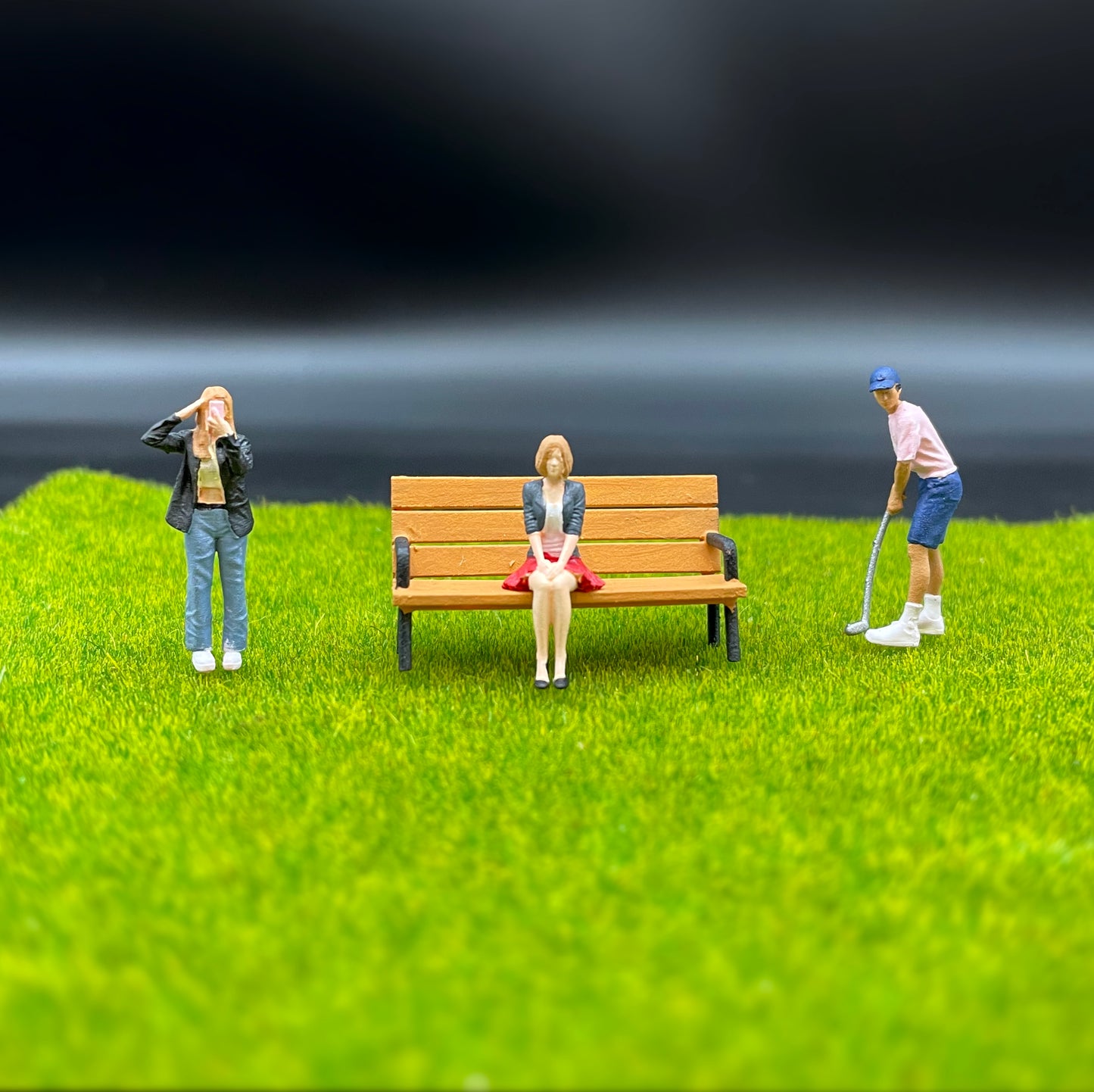 Selfie Girl, Woman Sat on Bench, Golf Player. 1:64 Scale. Miniature People