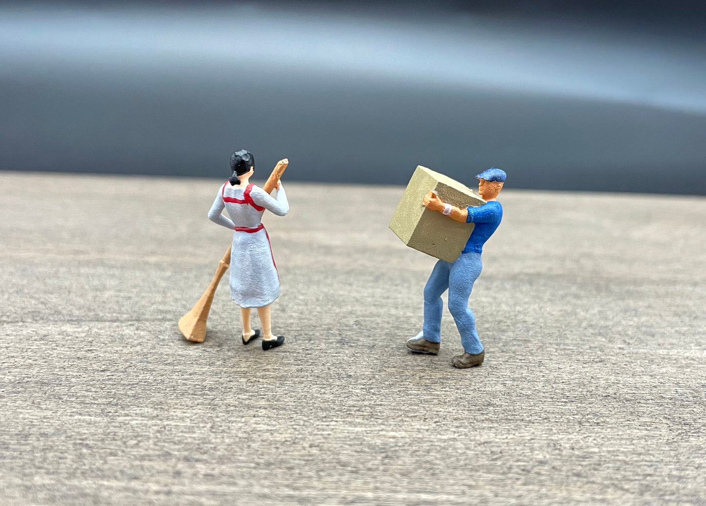 Woman Cleaning, Man Carrying Box. Miniature Human Figures. 1:64 Scale