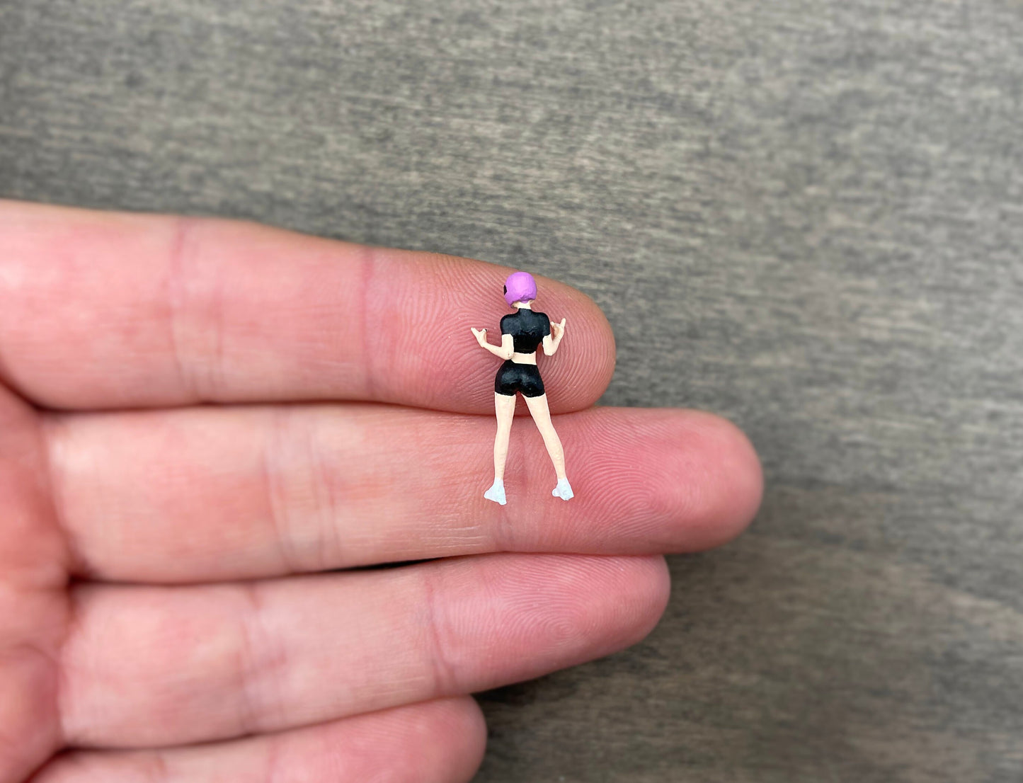 Girl in Pink Motorbike Helmet. Miniature Human Figure. 1:64 Scale