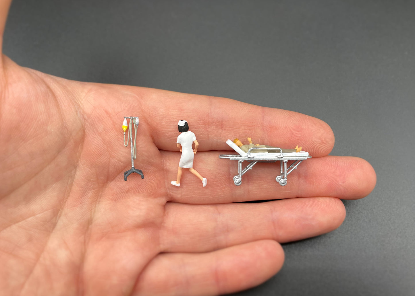 Nurse with Patient on Stretcher and IV. Miniature 1:64 Scale Model