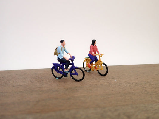 Miniature Figures Riding Bicycles. Hand-Painted Cyclist Models