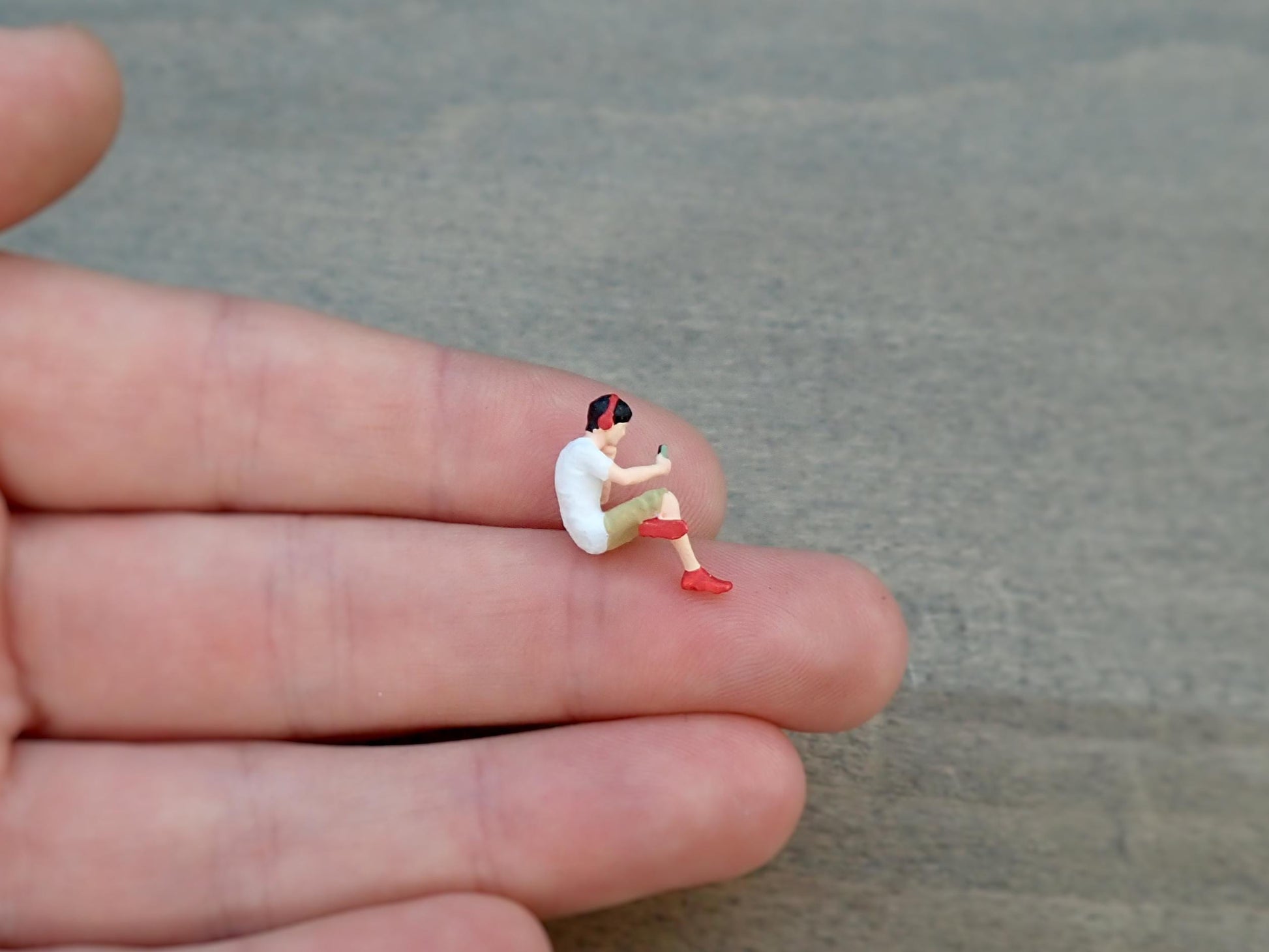 Miniature Person Looking at Phone 1:64 Scale Sitting Figure