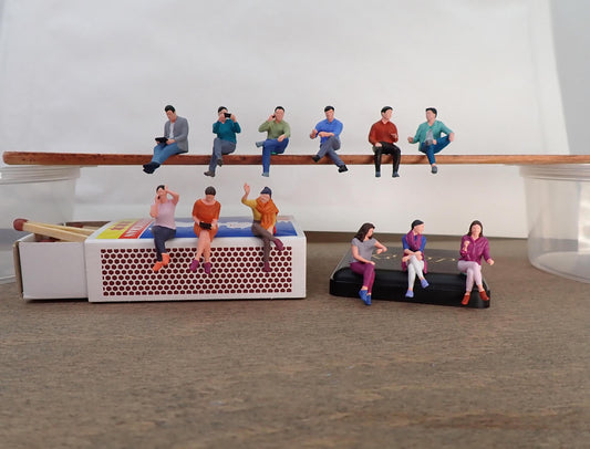 People Sat Down. Miniature Realistic Figures. 1:64 Scale