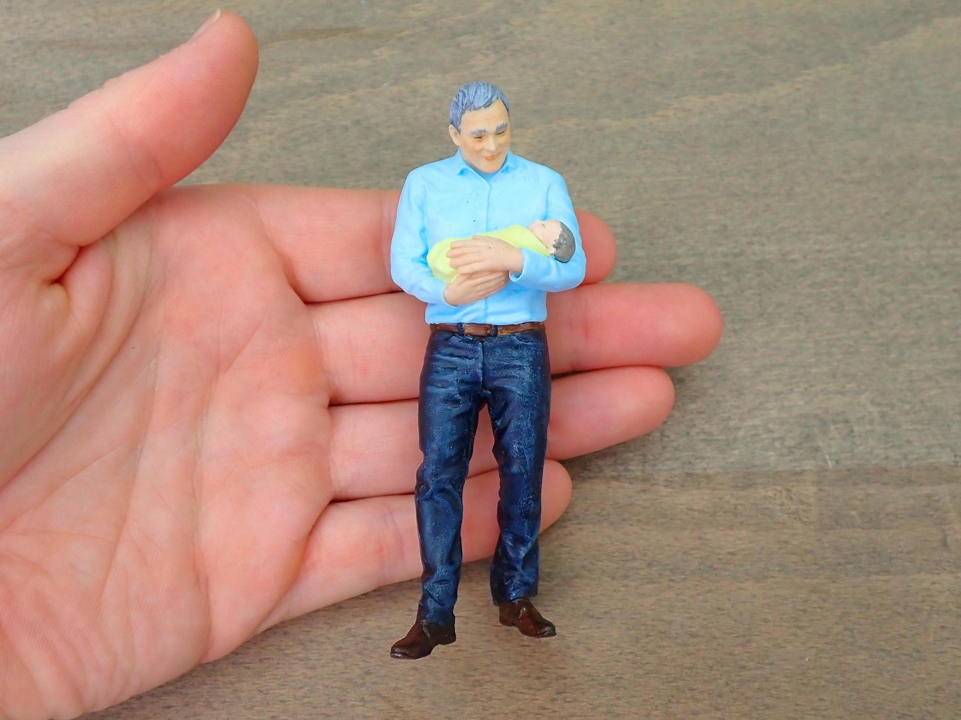 Man Holding Baby Infant 1:16 Scale 4 Inches Tall Scale Comparison